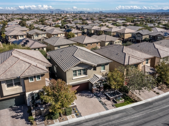 Aerial image of a Las Vegas neighborhood with the Strip skyline in the background.