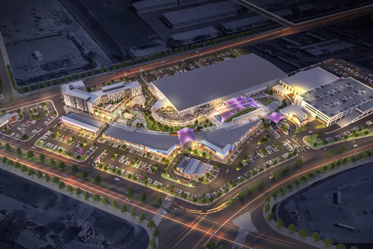 Rendering of the Hylo Park mixed-use development in North Las Vegas, showing retail shops, hotel, indoor sports complex, and pedestrian-friendly plaza planned for the former Texas Station casino site.