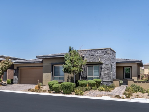 Contemporary single-story home at 9868 Gemstone Sunset Avenue in Regency at Summerlin, a 55+ community in Las Vegas.