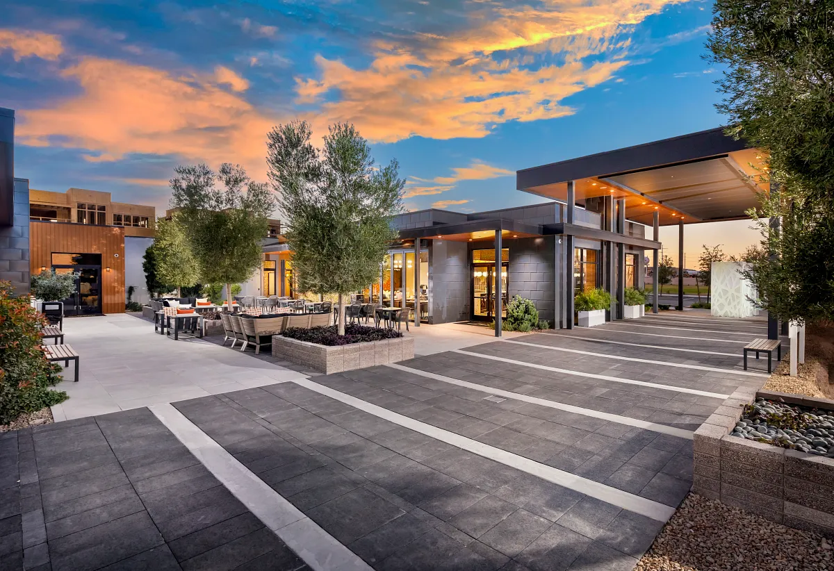 Modern clubhouse and outdoor gathering spaces at Trilogy in Summerlin, a guard-gated 55+ community in Las Vegas, Nevada.